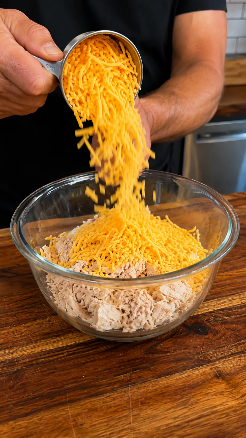 Shaping chicken mixture into patties on a baking sheet