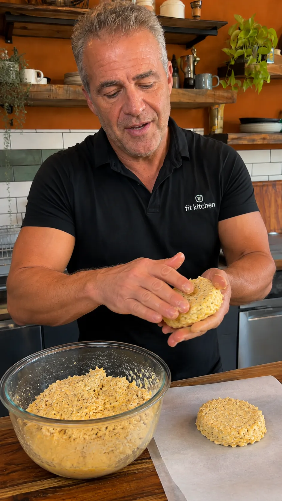 Mixing chicken, egg, cheddar, and seasoning in a bowl